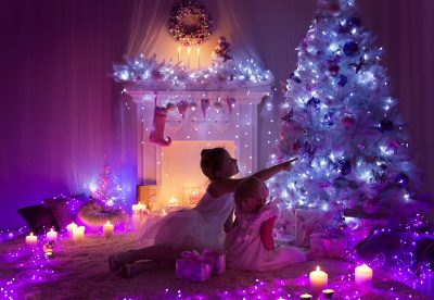 kids in bedroom with christmas tree